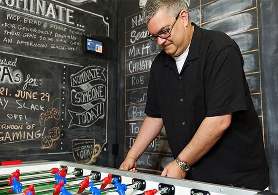 Todd playing foosball